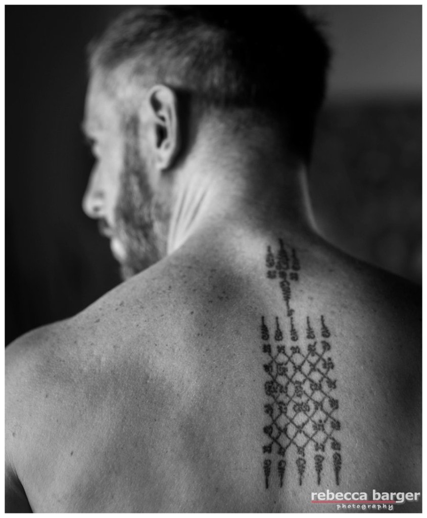 The groom's beautiful tattoo.