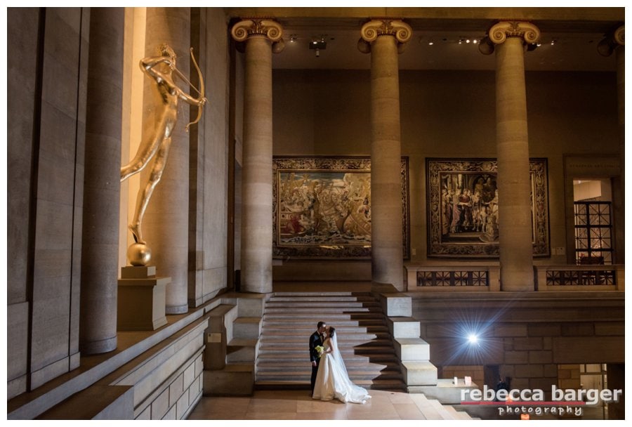 Ben + Holly share a wedding day kiss underneath the watchful eye of Diana who has reigned as the goddess of the Phila. Museum of Art's Grand Stair Hall since 1932, prior to then she was on top of NY's Madison Square Garden as a weathervane.