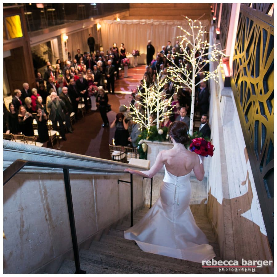 What a dramatic entrance Tracey makes as she descends the marble staircase.