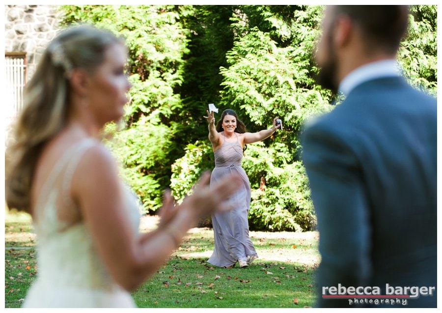 Audrey, sister of bride, rushes to the rescue with tissues for the crying bride.