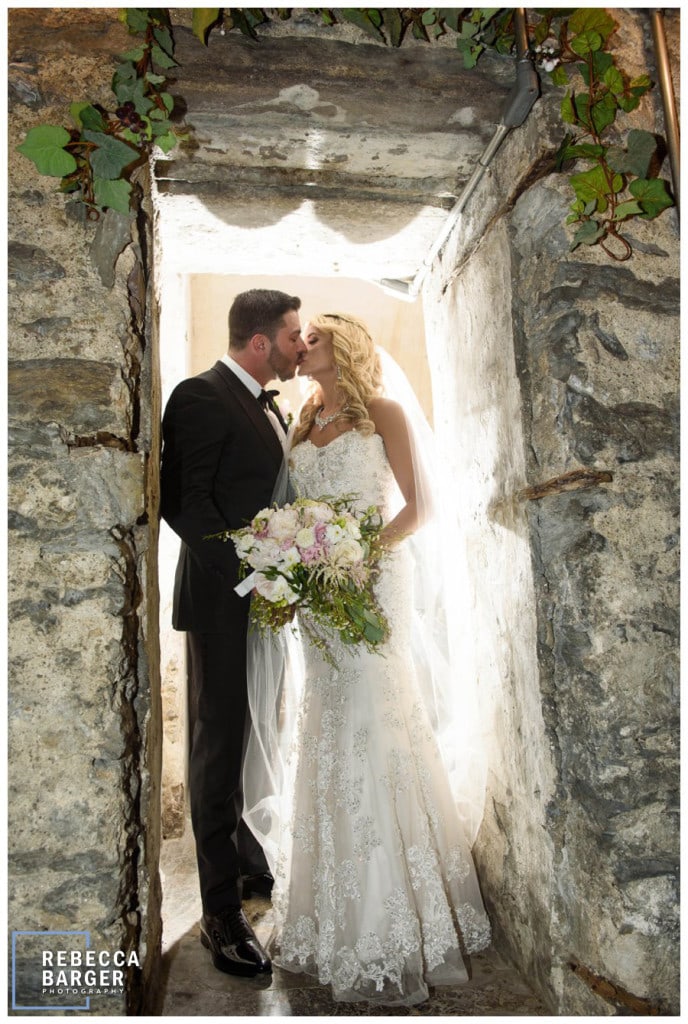 A just married kiss in the wine cellar of Philadelphia's Knowlton Mansion.